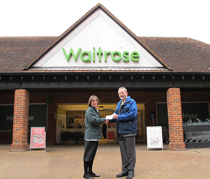 Liz Blake of Waitrose presents Chairman K. with their Green Token cheque for Â£240.